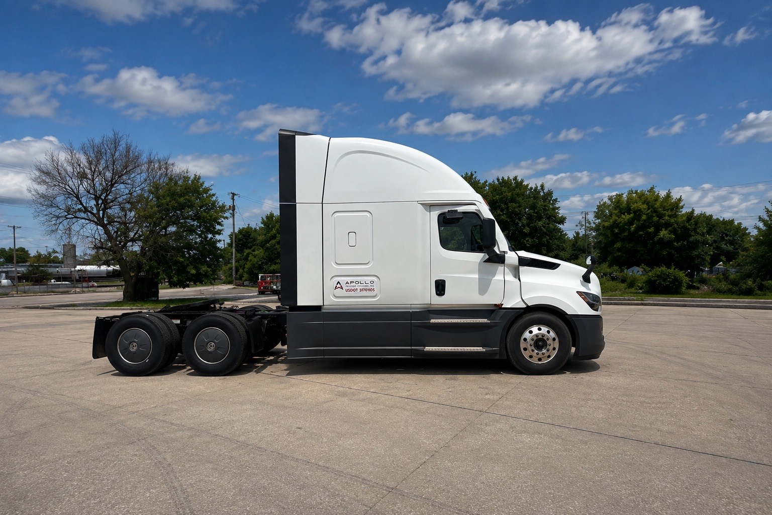 Aerodynamic Apollo Freight Systems sleeper cab semi-truck ready for an over-the-road run